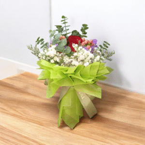Roses with baby's breath, hypericum, preserved statice, eucalyptus & caspia